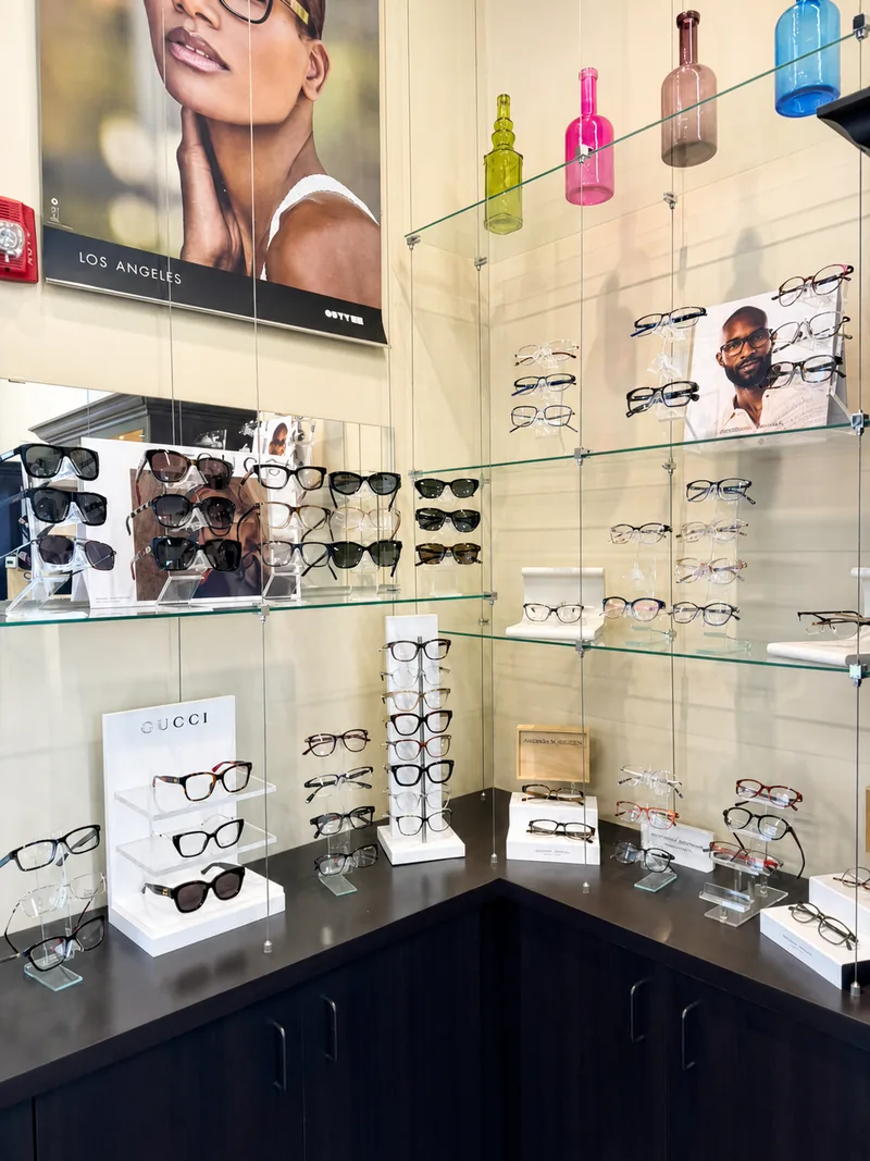 Gucci eyewear on a glass shelf display near the boutique entrance