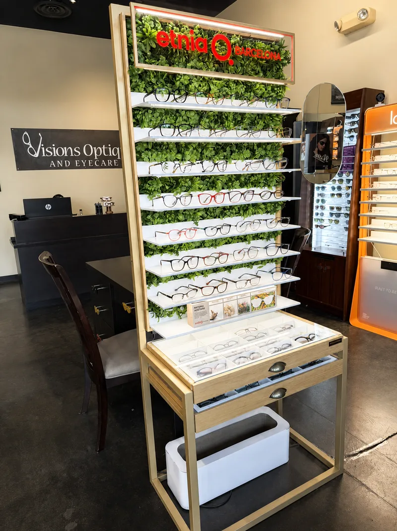 Rotating eyewear display beside the Visions Optique & Eyecare sign inside the North Scottsdale boutique