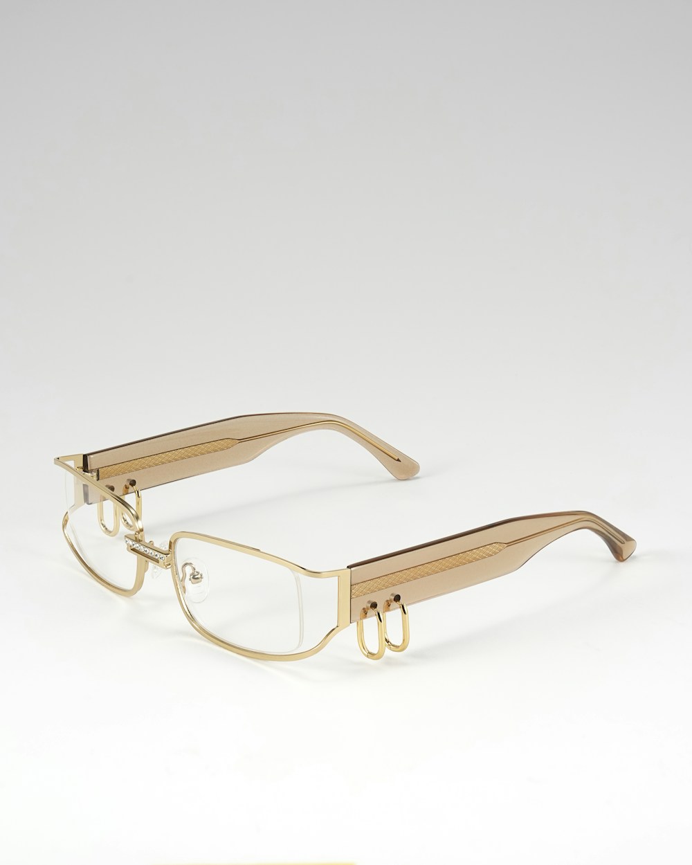 Gold-rimmed luxury eyeglasses — designer frames at Visions Optique & Eyecare, North Scottsdale