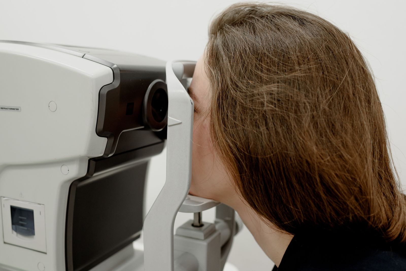 Patient undergoing eye pressure and optic nerve screening — glaucoma diagnosis and management at Visions Optique & Eyecare, North Scottsdale